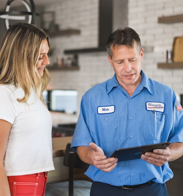 Magnuson Sheet Metal technician consulting with customer
